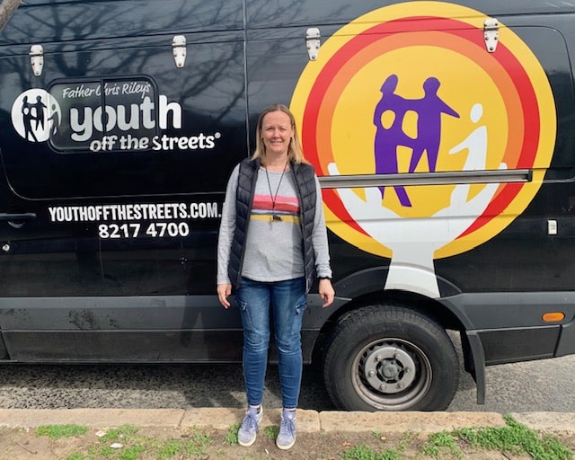 Sarah in front of Youth Off The Streets' food van