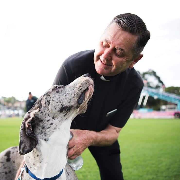 Father Chris Riley with his Great Dane