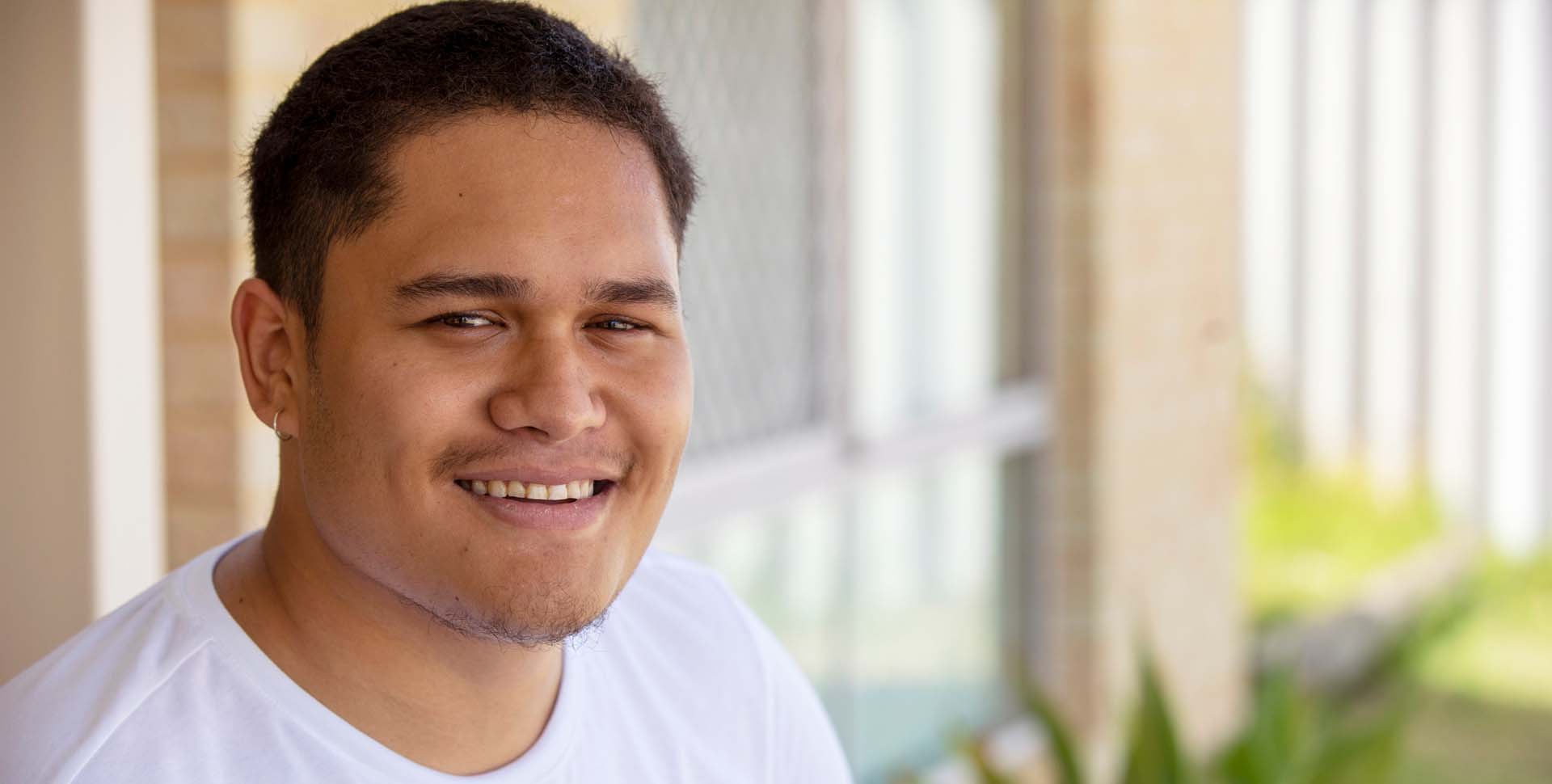 Joshua smiles after leaving juvenile detention and making changes for a better life
