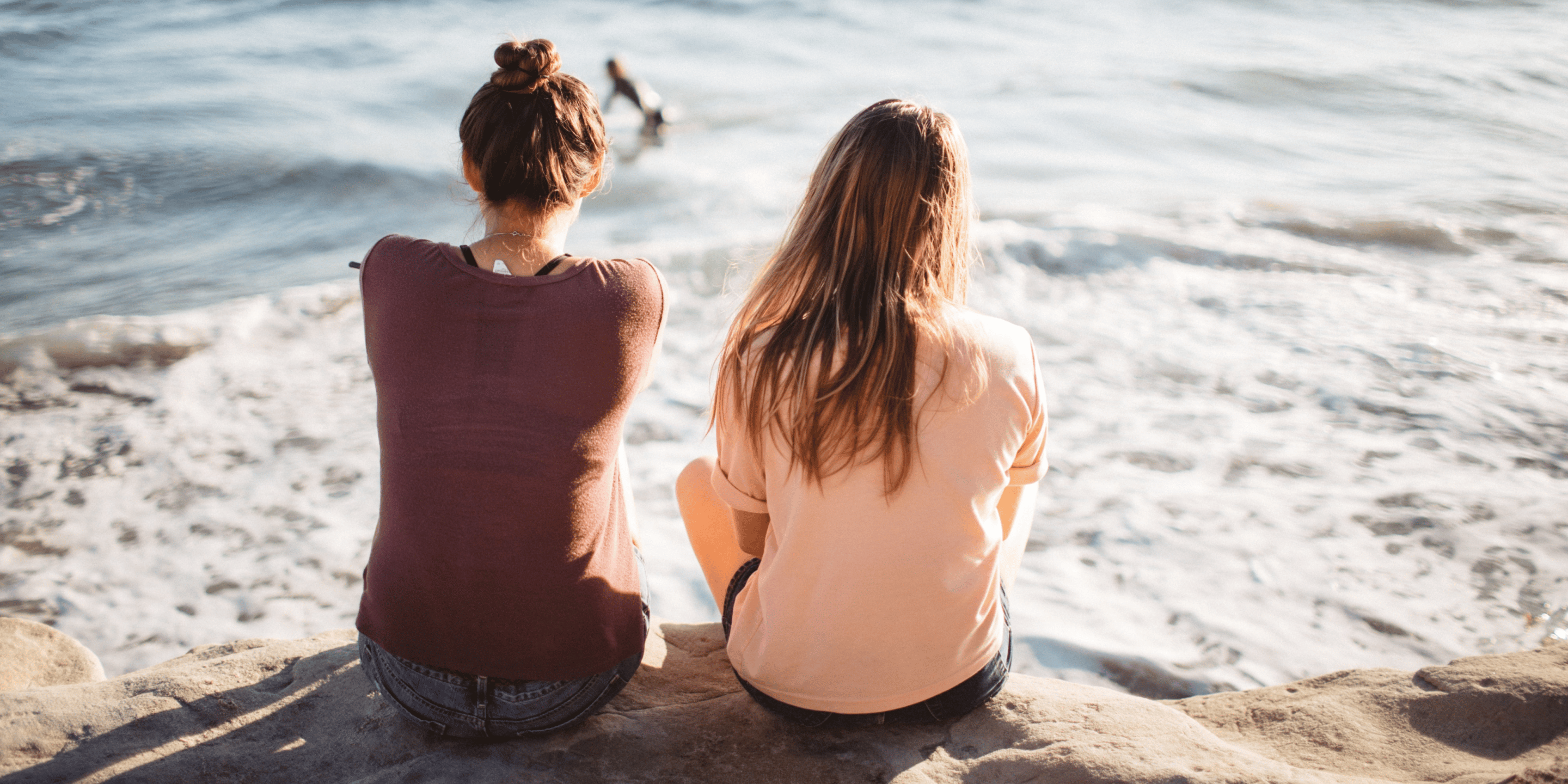 Male youth worker welcoming a teenage girl to a refuge