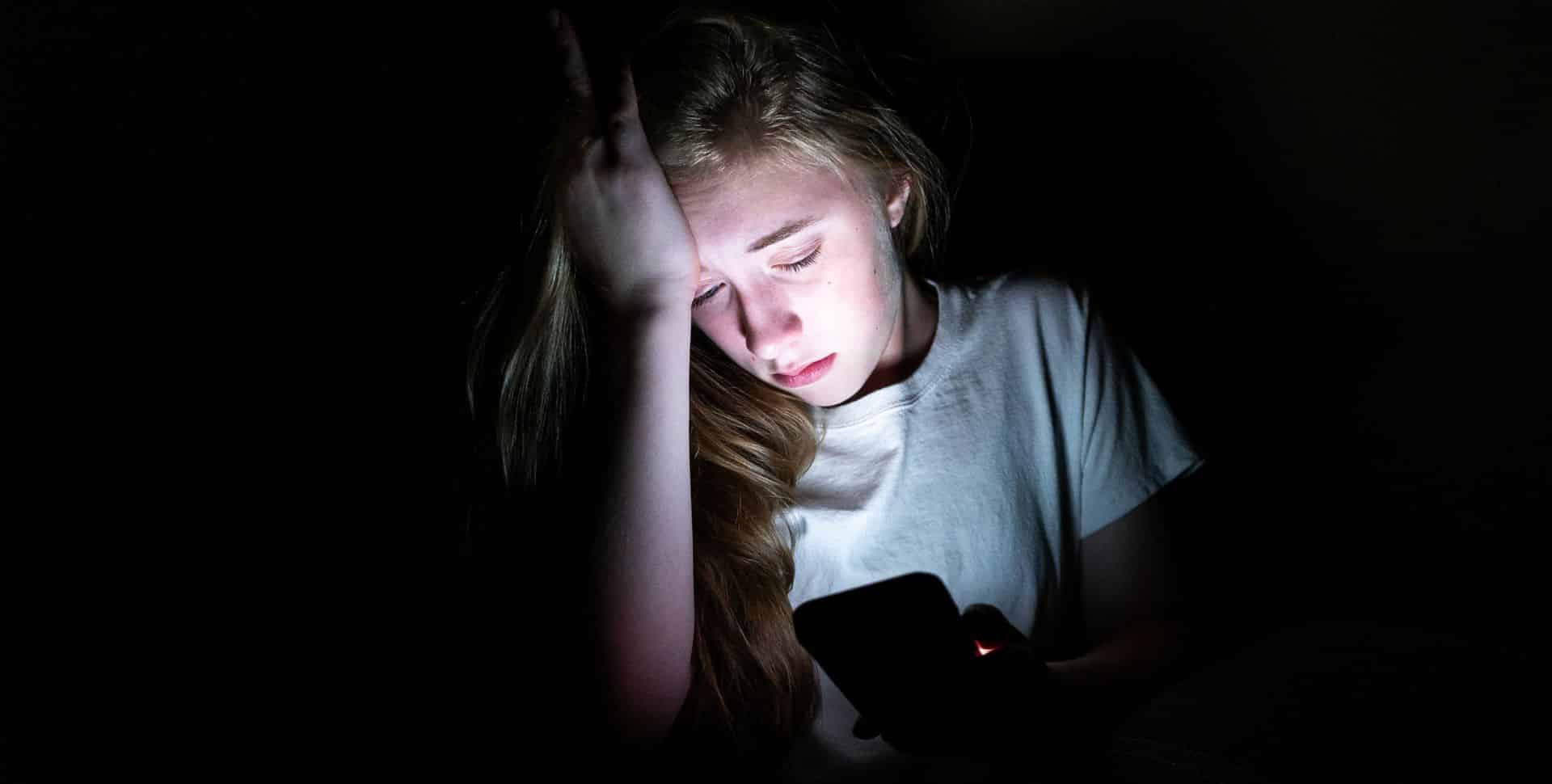 Male youth worker welcoming a teenage girl to a refuge