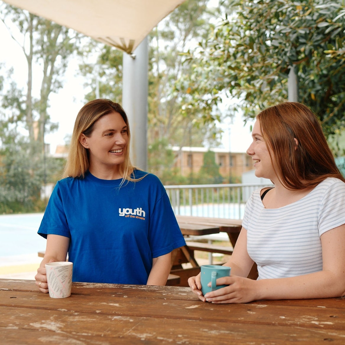 Two students sitting at desk in classroom