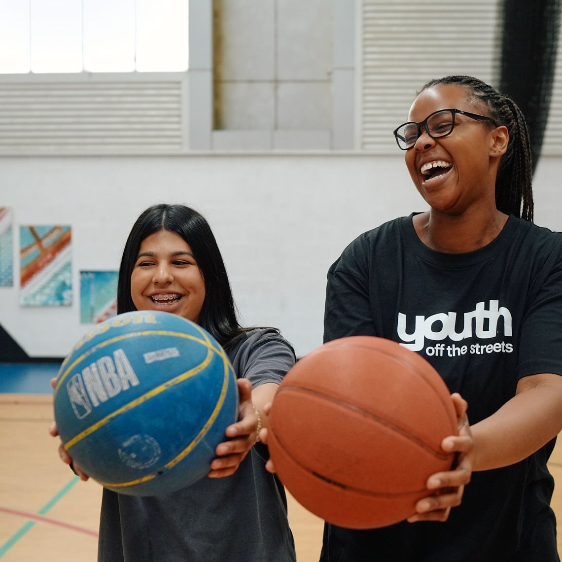 Teen girl receiving support from teacher