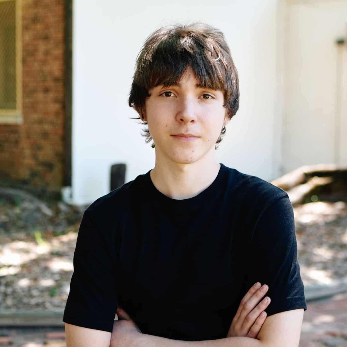 Sam resting against a wall