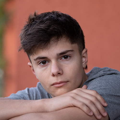 Sam resting against a wall