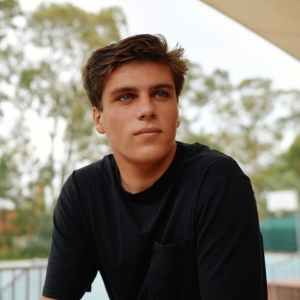 Teen boy walking past police station